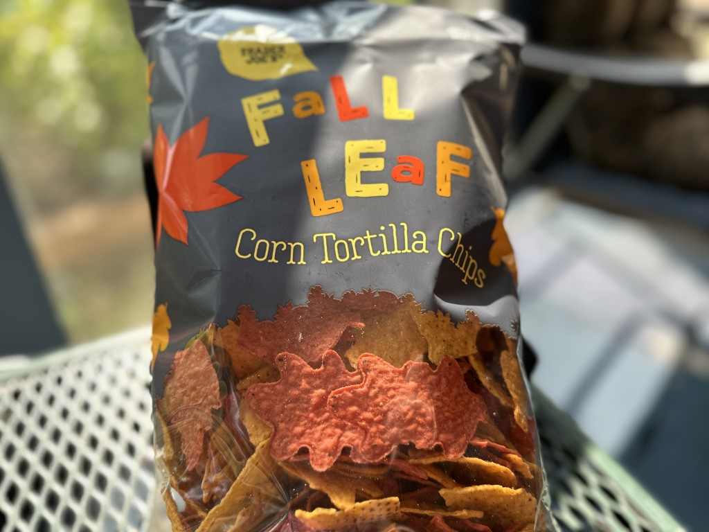 A close-up photo of a bag of Trader Joe's Fall Leaf Corn Tortilla Chips.